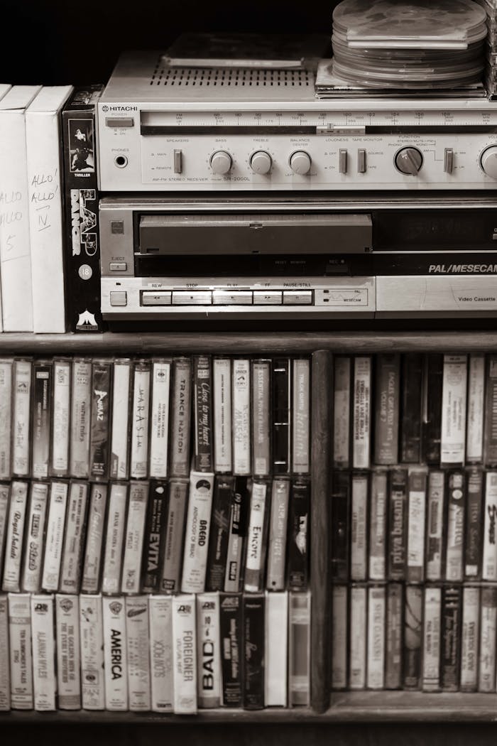Classic audio setup with cassette tapes and retro sound equipment in sepia tone.